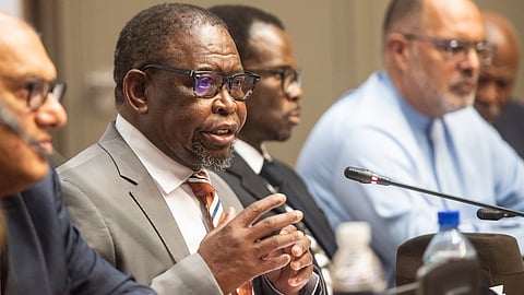 CAPE TOWN, SOUTH AFRICA - OCTOBER 26: Minister Enoch Godongwana holds a press conference at Parliament before the Medium Term Budget Policy Statement at Cape Town City Hall on October 26, 2022 in Cape Town, South Africa. The Medium Term Budget Policy sets government policy goals and priorities, forecasts macroeconomic trajectory and projects the fiscal framework over the next three years by outlining spending and revenue estimates. (Photo by Gallo Images/Brenton Geach)  )