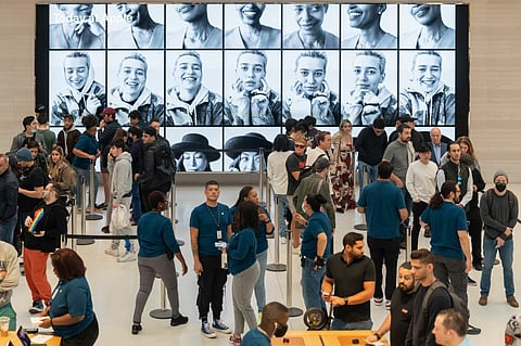 Shoppers at the Apple Fifth Avenue store in New York, US, on Friday, Sept. 16, 2022. The latest iPhone hits stores Friday, and Apple Inc. is counting on well-heeled shoppers to make the device a hit during a year of roaring inflation and shaky technology spending.
