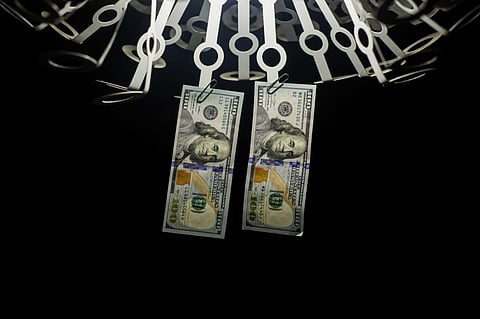 U.S. one-hundred dollar banknotes are arranged for a photograph in Hong Kong, China, on Monday, April 15, 2019. China's holdings of Treasury securities rose for a third month as the Asian nation took on more U.S. government debt amid the trade war between the worldÂ’s two biggest economies. Photographer: Paul Yeung/Bloomberg