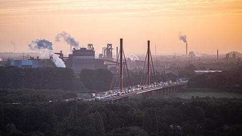 Cars cross a bridge while steem rises up from the ThyssenKrupp steel factory on October 06, 2022 in Duisburg, Germany. The German economy, and German industry in particular, are facing a foreboding combination of skyrocketing energy costs, the possibility of energy shortfalls this coming winter and a likely German economic recession, all of which are consequences stemming from Russia's ongoing war in Ukraine. (Photo by Lukas Schulze/Getty Images)