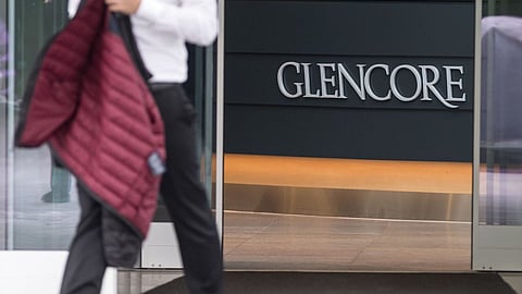 A man walks from the reception area at the Glencore Plc headquarters in Baar, Switzerland, on Wednesday, Sept. 30, 2015.  Photographer: Alessandro Della Bella/Bloomberg