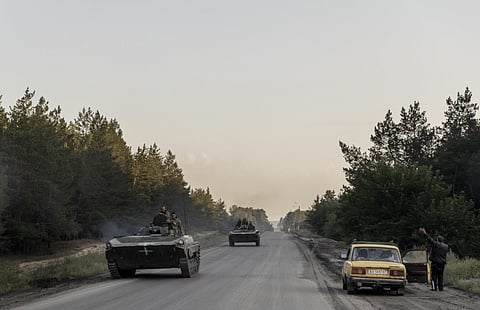 A man cheers passing soldiers last month in Izyum, Ukraine.
PHOTO: ADRIENNE SURPRENANT/MYOP FOR THE WALL STREET JOURNAL