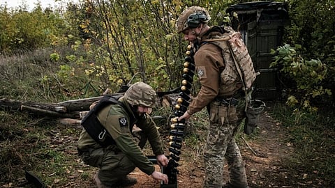 Soldiers of Ukraine's 5th Regiment of Assault Infantry put ammunition into a crate before setting a US-made MK-19 automatic grenade launcher towards Russian positions in less than 800 metres away at a front line near Toretsk in the Donetsk region on October 12. Photographer: Yasuyoshi Chiba/AFP/Getty Images