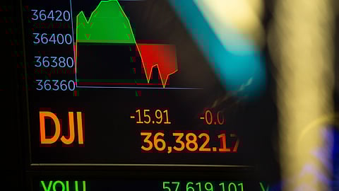 A monitor displays Dow Jones Industrial Average market data on the floor of the New York Stock Exchange (NYSE) in New York, U.S., on Friday, Dec. 31, 2021. U.S. stocks swung between gains and losses, with moves exacerbated by thin trading on the last session of the year. Photographer: Michael Nagle/Bloomberg
