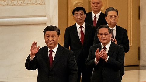Xi Jinping, China's president, front, and members of the Communist Party of China's new Politburo Standing Committee, arrive for its unveiling at the Great Hall of the People in Beijing, China, on Sunday, Oct. 23, 2022. President Xi Jinping stacked China's most powerful body with his allies, giving him unfettered control over the world's second-largest economy. Source: Bloomberg