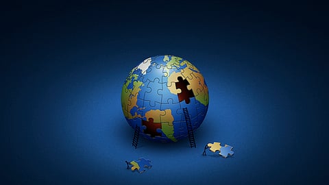 Digitally generated image of the Earth in puzzle pieces.