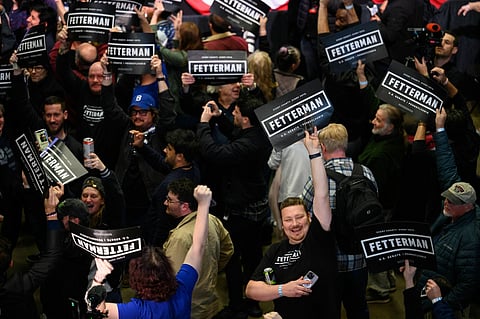 Attendees celebrate during an election night rally for John Fetterman, lieutenant governor of Pennsylvania Democratic senate candidate, in Pittsburgh, Pennsylvania, US, on Nov. 9. Photographer: Justin Merriman/Bloomberg