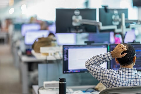 Employees work at computers at JPMorgan Chase & Co. offices in Bournemouth, UK, on Monday, Aug. 8, 2022. The British government's attempt to economically "level up" regions outside London is getting help from an unlikely quarter: Wall Street. Photographer: Jason Alden/Bloomberg