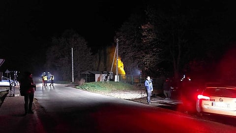 Members of the media, right, report from Przewodow village in Poland, on the Ukrainian border, after a suspected missile attack on Nov. 16, 2022. Photographer: Darek Puchala/Anadolu Agency/Getty Images