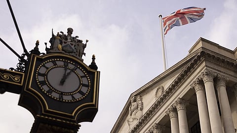 A British Union flag on top of the Bank of England (BOE) in the City of London, UK, on Monday, Oct. 17, 2022. The Bank of England said it was restarting its corporate bond-selling as it looks to return to normality in the wake of a sustained selloff in UK assets. Photographer: Jason Alden/Bloomberg