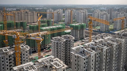 Evergrande apartment buildings under construction are seen in Beijing, China, on Fri., July 29, 2022.Photographer: Bloomberg