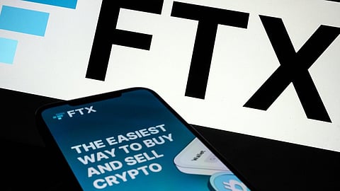 LONDON, ENGLAND - NOVEMBER 10: In this photo illustration the FTX logo and mobile app adverts are displayed on screens on November 10, 2022 in London, England. The Bahamas-based crypto exchange's larger rival, Binance, walked away from a potential bailout deal, as FTX struggles with a wave of customer withdrawals that have created a liquidity crunch. (Photo Illustration by Leon Neal/Getty Images)
