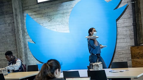 An employee carries plates of food at Twitter headquarters in San Francisco, California, U.S., on Thursday, March 17, 2022. Shares of Twitter Inc. jumped following the takeover announcement by Tesla CEO Elon Musk, narrowing the gap between the $54.20 offer price and the stock’s closing level Monday to $2.50/share, for a deal spread of 4.8% as of Monday close. Photographer: David Paul Morris/Bloomberg
