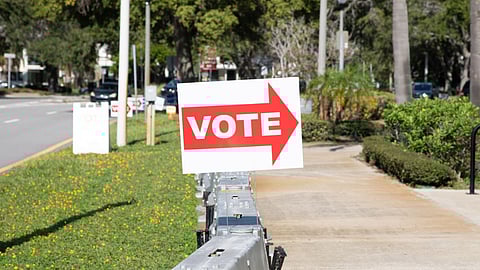 A "Vote" and Florida Gubernatorial Candidate Charlie Crist sign outside a polling location in Saint Petersburg, Florida, US, on Tuesday, Aug. 23, 2022. Republican Florida Governor Ron DeSantis, running unopposed in Tuesdays primary as he goes for a second term, has amassed $142 million from the start of 2021 through August 5 this year from donors including the hedge fund billionaires Ken Griffin and Paul Tudor Jones. Photographer: Tristan Wheelock/Bloomberg