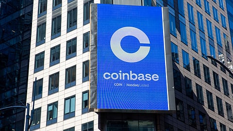 A monitor displays Coinbase signage during the company's initial public offering (IPO) at the Nasdaq MarketSite in New York, U.S., on Wednesday, April 14, 2021. Coinbase Global Inc., the largest U.S. cryptocurrency exchange, is set to debut on Wednesday through a direct listing, an alternative to a traditional initial public offering that has only been deployed a handful of times. Photographer: Michael Nagle/Bloomberg