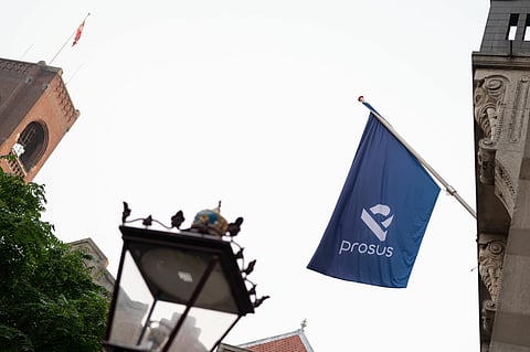 A Prosus flag is displayed ahead of the trading debut of the new Prosus NV unit of Naspers Ltd., outside the Amsterdam Stock Exchange, operated by Euronext NV, in Amsterdam, Netherlands, on Wednesday, Sept. 11, 2019. Naspers will retain 73% of the new company, which will house everything from a 31% stake in Chinese online giant Tencent to food delivery and advertising firms from the U.S. to India and Brazil.