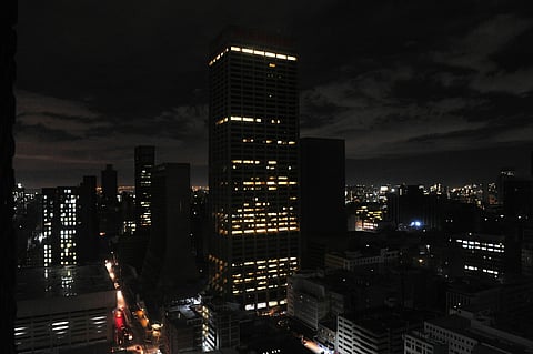 Partially lit office buildings on the city skyline during a loadshedding power outage period, in Johannesburg, South Africa. Photographer: Leon Sadiki/Bloomberg