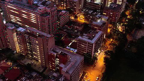Lit residential tower blocks in the Berea district of Johannesburg. Photographer: Waldo Swiegers/Bloomberg