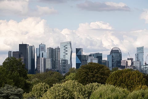 Skyscraper office buildings beyond trees in La Defense business district of Paris France, on Monday, Aug. 28, 2023. LaRef runs from Aug. 28-29.