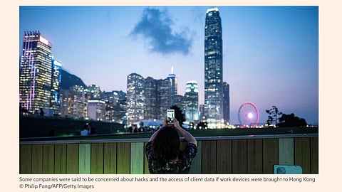 Major firms β including Deloitte and KPMG β turn to using burner phones while in Hong Kong