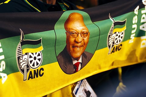 The image of Jacob Zuma, South Africa's president, sits on a banner during the 54th national conference of the African National Congress party (ANC) in Johannesburg, South Africa, on Saturday, Dec. 16, 2017. Zuma urged the ruling African National Congress to fight factionalism and consider accommodating members of rival slates in its new leadership that will be elected at its national conference.