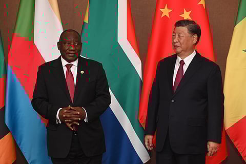 Cyril Ramaphosa, South Africa's president, left, and Xi Jinping, China's president, during the China-Africa leaders' roundtable on the closing day of the BRICS summit at the Sandton Convention Center in the Sandton district of Johannesburg, South Africa, on Thursday, Aug. 24, 2023. Expansion of BRICS membership is top of the agenda for the summit being hosted this week by South Africa. Photographer: Leon Sadiki/Bloomberg