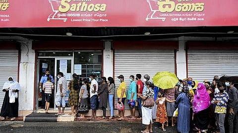 Trouble in the island: long queues outside shops are a common sight in Sri Lanka