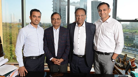 Chopra and Dugar with their sons Prashant and Gaurav: building a credible image