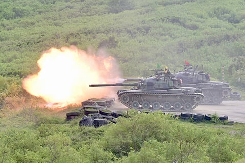 SAM YEH/AGENCE FRANCE-PRESSE
CM-11 tanks fire their cannons during a live-fire military exercise in Pingtung county, southern Taiwan.
