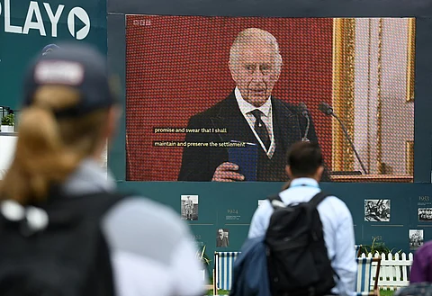 Britain's King Charles III is seen on a giant screen as he speaks during a meeting of the Accession Council to proclaim his as the King, on day 2 of the BMW PGA Championship at Wentworth Golf Club, south-west of London, on September 10, 2022. - The European golf's PGA Championship resumes Saturday, after it was cancelled on Friday as a mark of respect following the death of Queen Elizabeth II on September 8. Photo by Glyn KIRK / AFP