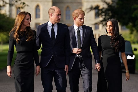 (L-R) Britain's Catherine, Princess of Wales, Britain's Prince William, Prince of Wales, Britain's Prince Harry, Duke of Sussex, and Meghan, Duchess of Sussex on the long Walk at Windsor Castle on September 10, 2022, before meeting well-wishers. - King Charles III pledged to follow his mother's example of "lifelong service" in his inaugural address to Britain and the Commonwealth on Friday, after ascending to the throne following the death of Queen Elizabeth II on September 8. Photo by Kirsty O'Connor / POOL / AFP