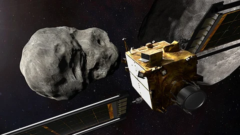 This file artist's illustration obtained from NASA on November 4, 2021 shows the DART spacecraft from behind prior to impact at the Didymos binary system. - NASA on Monday will attempt a feat humanity has never before accomplished: deliberately smacking a spacecraft into an asteroid to slightly deflect its orbit, in a key test of our ability to stop cosmic objects from devastating life on Earth. Photo by Handout / NASA / AFP