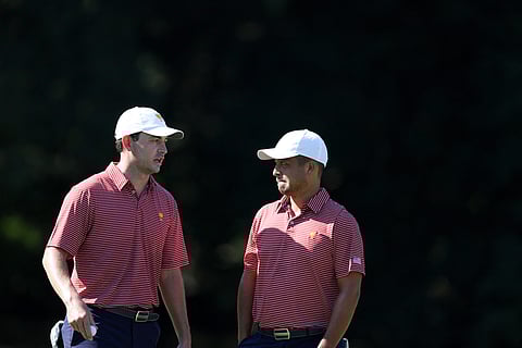 ROB CARR/AGENCE FRANCE-PRESSE
Patrick Cantlay (left) and Xander Schauffele discuss strategy during practice in the run-up to the Presidents Cup.