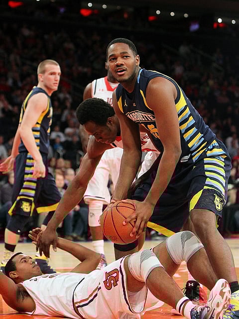 Steve Taylor Jr. (#25) of the Marquette Golden Eagles looks on as he is called for a foul. Photo by Nate Shron/Getty Images/AFP