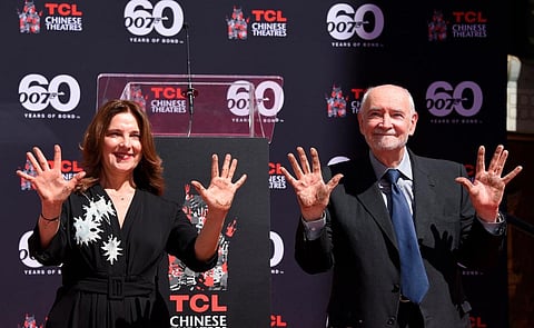 James Bond producers Michael Wilson (R) and Barbara Broccoli take part in their Hand and footprint ceremony at TCL Chinese Theatre in Hollywood, California, on September 21, 2022. | AFP