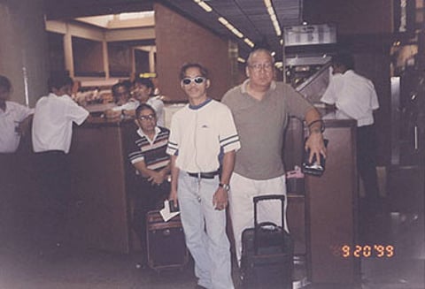 Manny Pacquiao and his handlers, Rod Nazario (right) and Lito Mondejar (left) wait for their flight to Manila at Don Muang Airport in Bangkok three days after losing the world title.