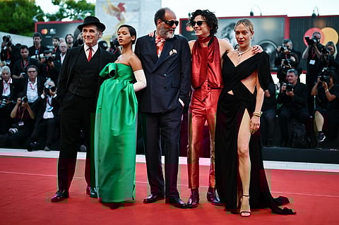 (From L) British actor Mark Rylance, Canadian actress Taylor Russell, Italian director Luca Guadagnino, French US actor, Timothee Chalamet and US actress Chloe Sevigny arrive on September 2, 2022 for the screening of the film "Bones And All" presented in the Venezia 79 competition as part of the 79th Venice International Film Festival at Lido di Venezia in Venice, Italy. |
Marco BERTORELLO / AFP