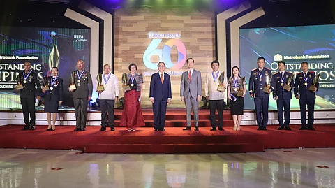 The 2022 Metrobank Foundation Outstanding Filipinos composed of four (4) teachers, three (3) soldiers, and three (3) police officers receive a P1 million cash prize, a gold medallion, and “The Flame” trophy from Metrobank chairman Arthur V. Ty and Metrobank Foundation president Aniceto M. Sobrepeña in a hybrid conferment ceremony on 5 September 2022 at the Metrobank Plaza Auditorium, Makati City.