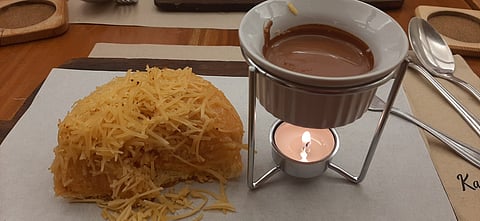 Photographs by Maria Thenesse Cornelio for the daily tribune
ensaymada, when smothered with Malagos Chocolate sauce, produces a mildly bittersweet taste perfect for non-sweets lovers.