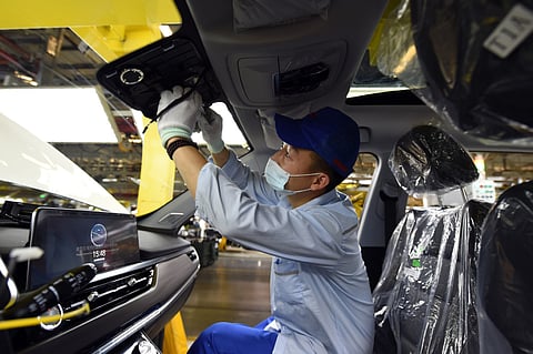 Holding Group employee installs parts in a vehicle at the company’s plant in Wuhu, Anhui province. | PHOTOGRAPH COURTESY OF XINHUA
CHERY