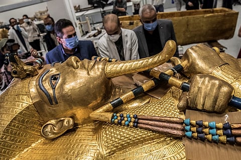 The golden sarcophagus of the ancient Egyptian Pharaoh Tutankhamun at the restoration lab of the newly-built Grand Egyptian Museum in Giza, Egypt. Ahead of the bicentenary of the deciphering of the Rosetta Stone -- which unlocked the key to reading ancient hieroglyphs -- and the 100th anniversary of Howard Carter's earth-shattering discovery, Egyptians are demanding that their contributions to the discoveries be recognized and artefacts abroad returned. (Photo by KHALED DESOUKI / AFP)