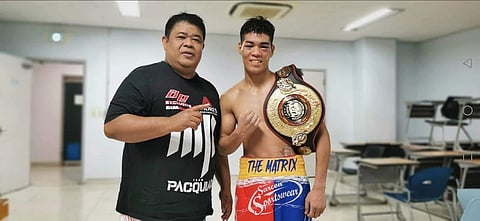 Photograph Courtesy of Nonoy Neri
Lienard Sarcon (right) celebrates the biggest victory of his career alongside trainer Nonoy Neri in Korea.