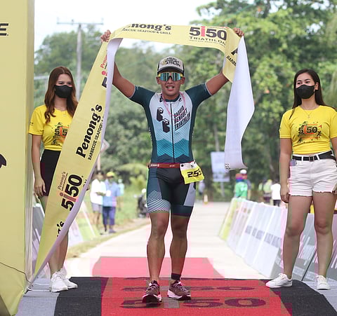 PHOTOGRAPH COURTESY OF IRONMAN
JOSHUA Ramos crosses the finish line to rule the Penong’s 5150 Davao Triathlon in Tagum City, Davao del Norte.