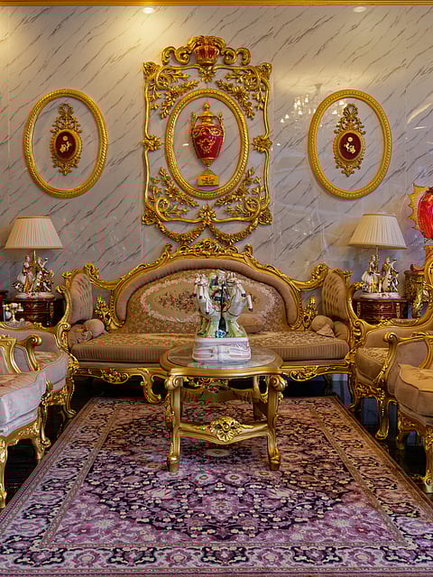 The living room boasts of an ornate sala set.