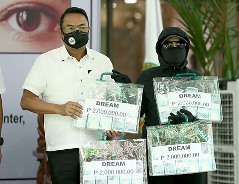 Money well-earned A tipster of the Philippine Drug Enforcement Agency receive from PDEA Director General Wilkins Villanueva a total of P8 million as cash rewards for providing information that led to four successful drug busts. | Photograph by Analy Labor for the daily tribune @tribunephl_ana