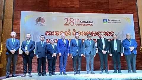 MOST Reverend Olivier Schmitthaeusler, Apostolic Vicar of Phnom Penh and Bishop of Catabum Castra (eighth from left); UST Rector Very Rev. Fr. Richard G. Ang, O.P., Ph.D.; and leaders of ASEACCU member institutions. | PHOTOGRAPH COURTESY OF UST