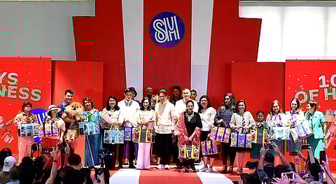 Representatives from the Quezon City LGU, SM Supermalls, Girl Scouts of the Philippines, Brownies Unlimited, Spark PH, and Down Syndrome Association of the Philippines come together for SM Supermalls' 100 Days of Happiness. (Photo courtesy of SM Supermalls)