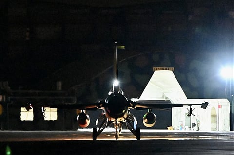A F-16V fighter jet stands by during a drill at Hualien Air Force base on 17 August 2022. In an interview with US broadcaster CBS that was aired on Sunday, US President Joe Biden was asked whether US troops would defend Taiwan, and replied "yes", if it were "an unprecedented attack". (Photo by SAM YEH / AFP)