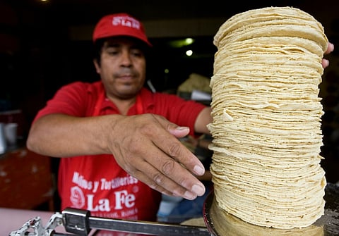 The price of the corn flour used to make tortillas in Mexico -- a staple used for tacos and other dishes -- is up by around 13 percent from last year and contributing to two-decade high inflation. (Photo by SAM PANTHAKY / AFP)
