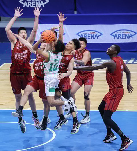 UP players stop La Salle's Evan Nelle from scoring during the UAAP Season 84 Men's Basketball semifinals game 2 at Mall of Asia Arena in Pasay, May 6, 2022. Photo by Rio Deluvio